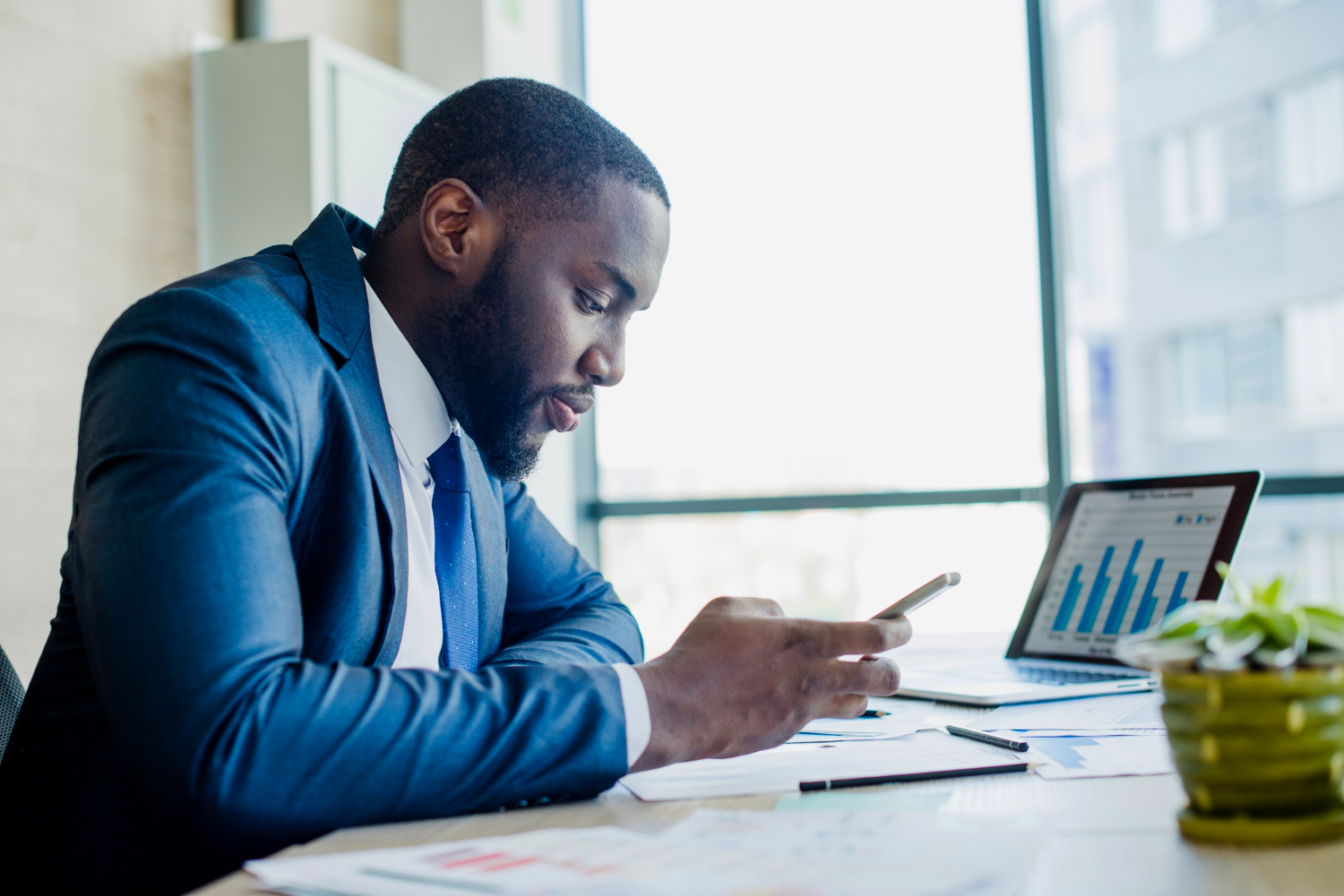 Busy business person on a tablet looking at reports